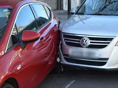 Two cars that bumped into each other in a street